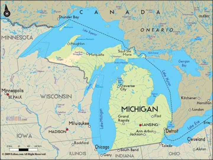 How far is Michigan from Canada by plane?